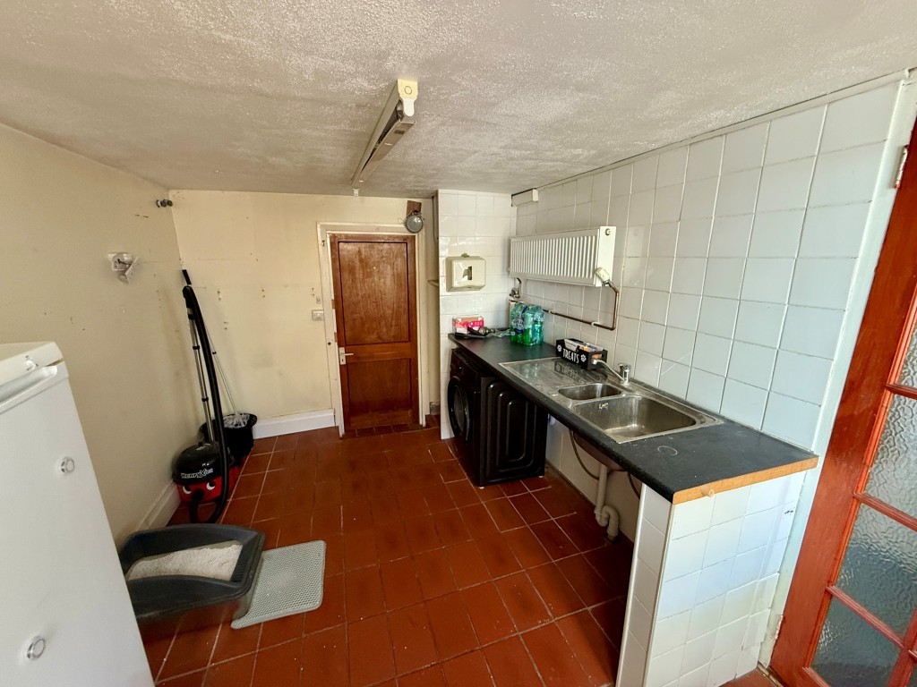 Lot: 106 - THREE-BEDROOM EXTENDED BUNGALOW FOR IMPROVEMENT - Utility room with access to garage